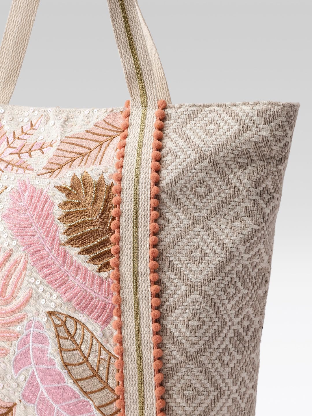 PRIMROSE Woven Beach Tote Bag with Tropical Leaf Embroidery, Peach Pom Pom Trim, Cream and Pink