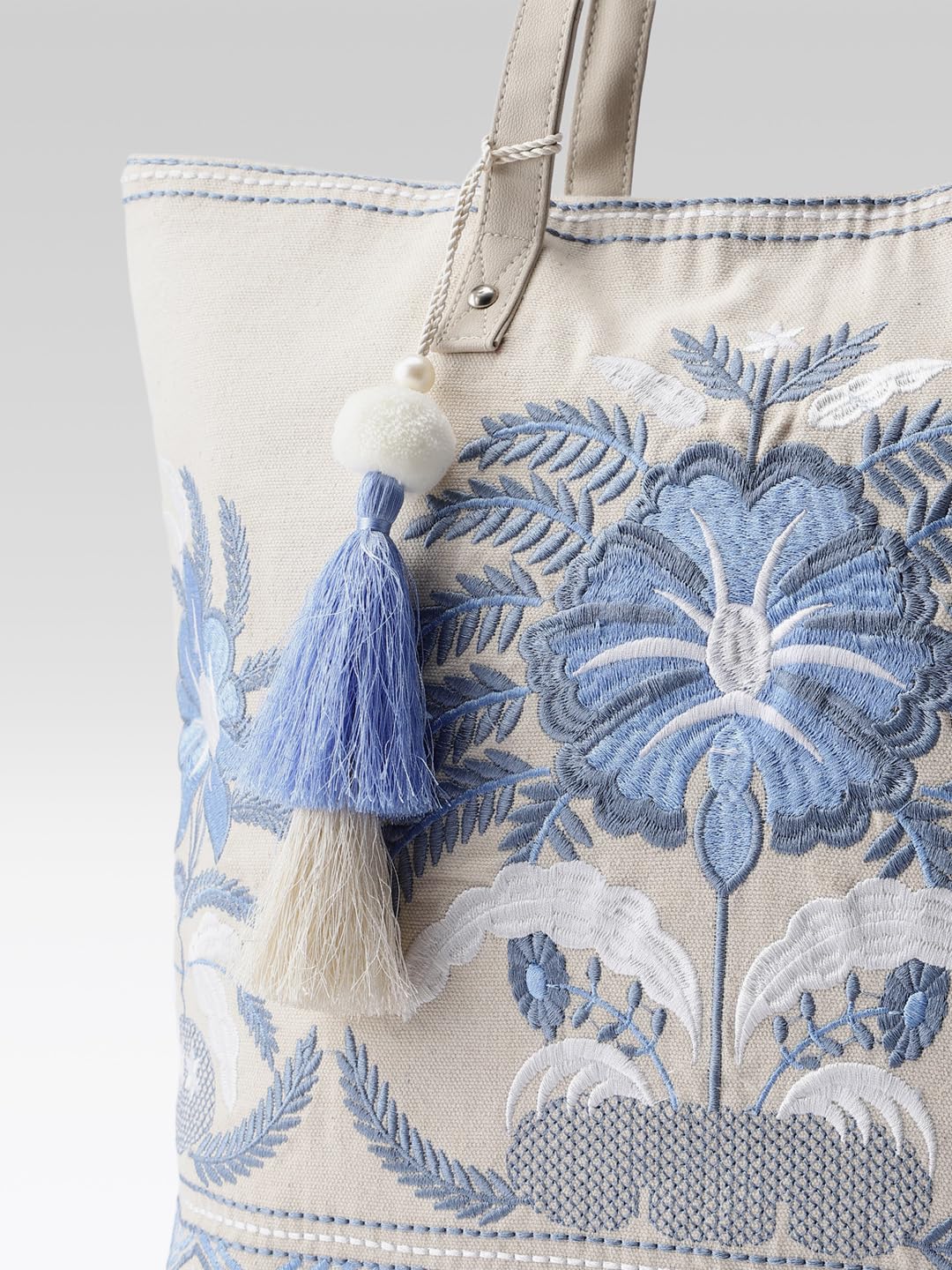 PRIMROSE Embroidered Canvas Tote Bag with Blue Floral Design, Decorative Tassels, Cream Colour