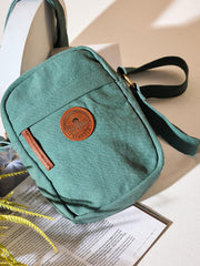 RIMROCK Canvas Crossbody Utility Bag, Mint Green with Leather Accents and Mountain Badge